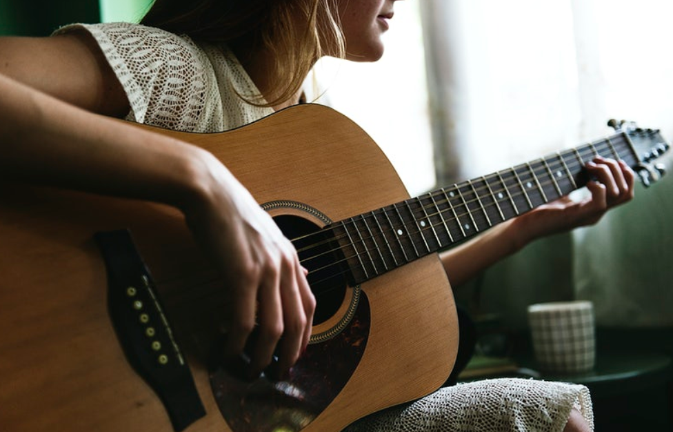 woman playing guitar